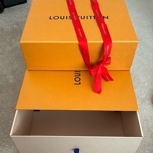 Two Louis Vuitton boxes - one medium and one small shoes boxes.